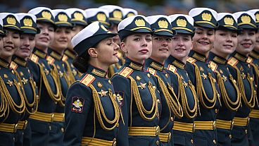 Russian servicewomen march during the Victory Day military parade in Moscow, Russia, Thursday, May 9, 2024.
