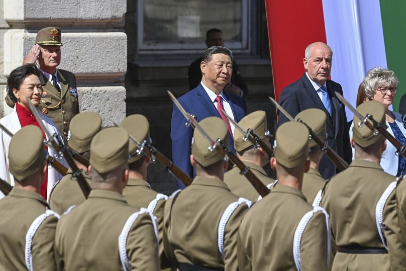 Hungarian President Tamas Sulyok, rear right, receives Chinese President Xi Jinping with military honours in the Lion Court of the Castle of Buda in Budapest, 9 May 2024