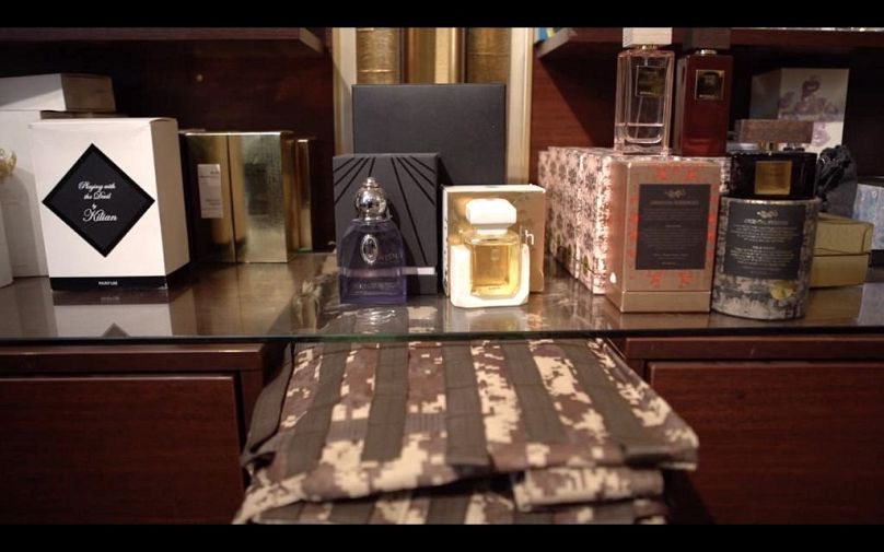 Ballistic vest sleeves amongst perfume bottles