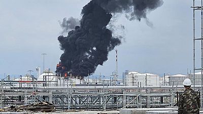 Black smoke billows after an explosion at the gas storage tanks in an industrial area in Rayong province, eastern of Thailand, Thursday, May 9, 2024.