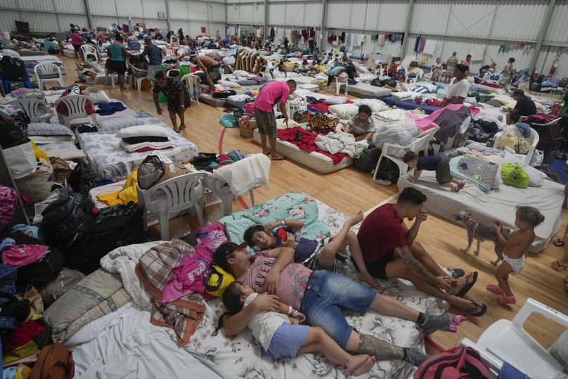 Residents rest in a makeshift shelter for people whose homes were flooded by heavy rains, in Canoas, Rio Grande do Sul state, Brazil.