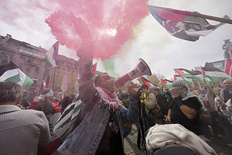 A protester shouts into a megaphone during a Pro-Palestinian demonstration for excluding Israel from Eurovision ahead of the second semi-final