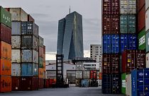 The European Central Bank is pictured next to containers in Frankfurt