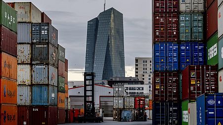 The European Central Bank is pictured next to containers in Frankfurt