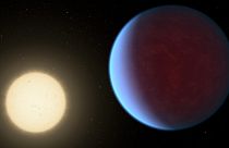 Scientists used data from the James Webb Telescope to discover the super Earth exoplanet 55 Cancri e, seen here orbiting its star, had a thick atmosphere.