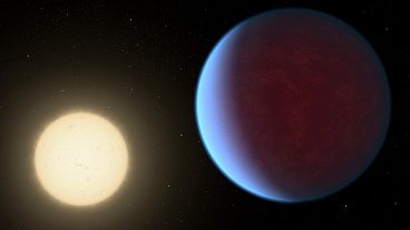Scientists used data from the James Webb Telescope to discover the super Earth exoplanet 55 Cancri e, seen here orbiting its star, had a thick atmosphere.