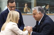 Hungary's Prime Minister Viktor Orban, right, speaks with Italy's Prime Minister Giorgia Meloni, centre, and Poland's former Prime Minister Mateusz Morawiecki, left 