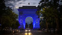 The Arc de Triomphe is illuminated in the EU colors to mark Europe Day, in Bucharest, Romania, Thursday, May 9, 2024