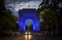 The Arc de Triomphe is illuminated in the EU colors to mark Europe Day, in Bucharest, Romania, Thursday, May 9, 2024
