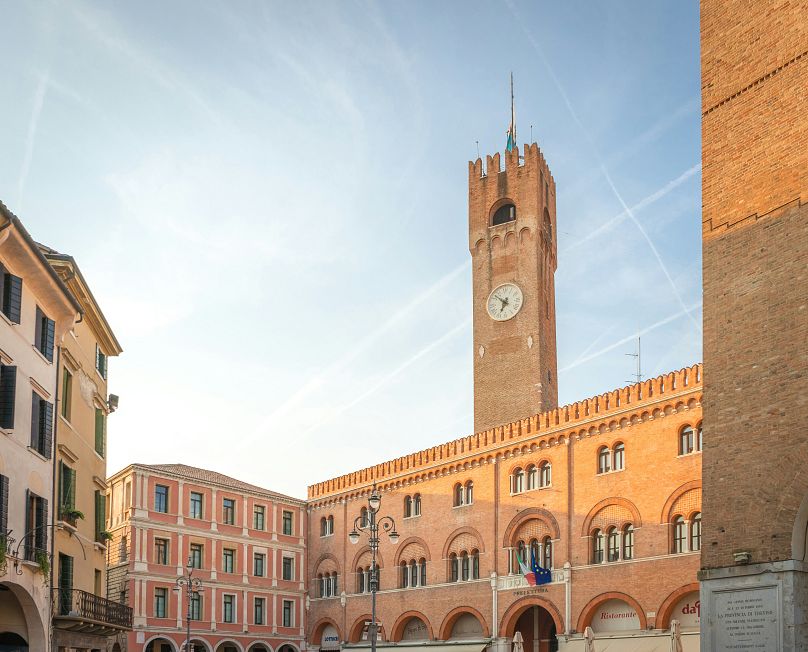 The grand Piazza dei Signori is home to the 13th-century castellated Palazzo dei Trecento.