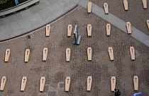 Milan piazza filled with mock coffins to protest workers' deaths, May 11th 2024