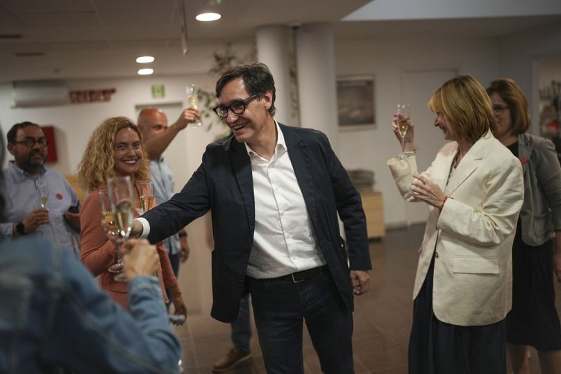 Socialist candidate Salvador Illa makes a toast with members of his team and party colleagues after the announcement of the results of elections to the Catalan parliament
