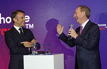 Microsoft CEO Brad Smith, right, speaks to French President Emmanuel Macron at the French Microsoft headquarters in Issy-les-Moulineaux, outside Paris. May 13, 2024. 