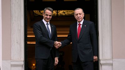 FILE - Greece's Prime Minister Kyriakos Mitsotakis, left, welcomes the Turkey's President Recep Tayyip Erdogan before their meeting at Maximos Mansion in Athens, Greece in 202