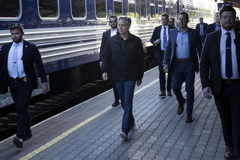U.S. Secretary of State Antony Blinken, center, walks to board a Ukrainian Railways train at Przemysl Glowny train station while traveling to Kyiv, Ukraine, Monday, 13 May 24.