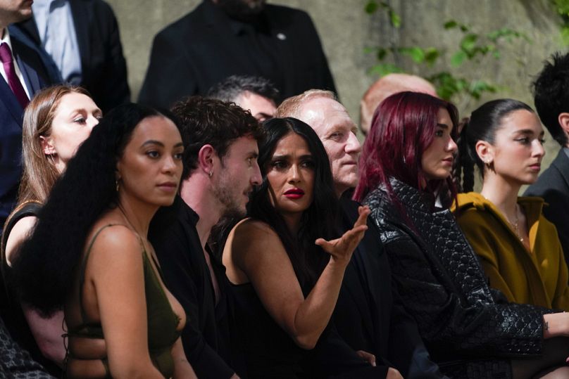 From second left, Paul Mescal, Selma Hayek, François-Henri Pinault and Dua Lipa attend the Gucci Cruise fashion show in London, Monday, May 13, 2024.