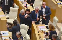 This photo taken from video, released by Mtavari Channel on Tuesday, May 14, 2024, shows Georgian lawmakers fighting during a parliament session in Tbilisi, Georgia.