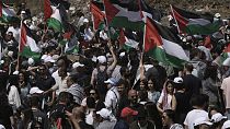 People take part in a march in support of the Palestinian people ahead of the Nakba day at the Al Kasayir village, in Haifa, Tuesday, May 14, 2024 (AP Photo/Mahmoud illean)