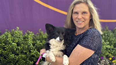 Cynthia Hornor poses with Nimble, the first mixed-breed dog ever to win the Westminster Kennel Club dog show's agility competition, Monday, May 13, 2024