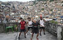 Youth perform a street dance style known as passinho for their social media accounts, in the Rocinha favela of Rio de Janeiro, Brazil, Wednesday, April 17, 2024.