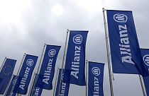 Flags of the German insurer Allianz wave prior to the company's annual shareholders meeting in Munich, southern Germany.