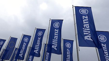Flags of the German insurer Allianz wave prior to the company's annual shareholders meeting in Munich, southern Germany.
