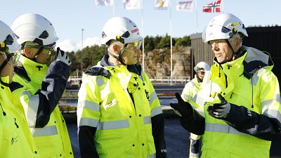 Norwegian Prime Minister Jonas Gahr Støre (centre) tours the Northern Lights CCS project site in 2022 after opening a visitor centre.