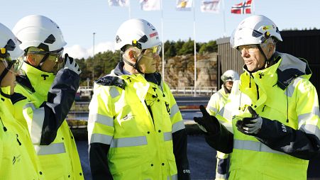 Norwegian Prime Minister Jonas Gahr Støre (centre) tours the Northern Lights CCS project site in 2022 after opening a visitor centre.