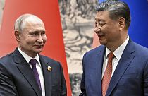 Chinese President Xi Jinping, right, and Russian President Vladimir Putin shake hands prior to their talks in Beijing, China, on Thursday, May 16, 2024.