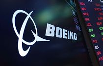 The logo for Boeing appears on a screen above a trading post on the floor of the New York Stock Exchange, July 13, 2021.