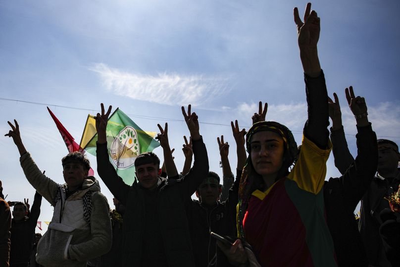 Supporters of the pro-Kurdish Peoples' Equality and Democracy Party (DEM) chant slogans during the Newroz celebrations in Istanbul.