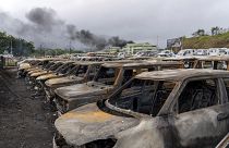Burnt cars are lined up after unrest in Noumea, New Caledonia.