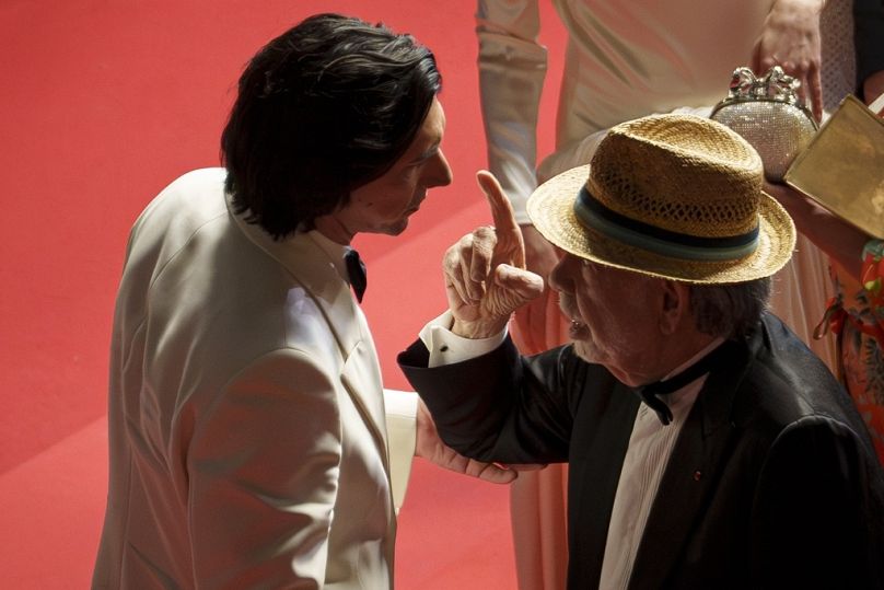 Adam Driver, left, talks with director Francis Ford Coppola as they depart from the premiere of the film 'Megalopolis' at the 77th international film festival, Cannes