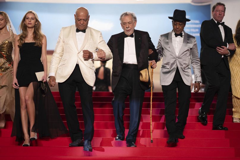Grace VanderWaal, Romy Mars, Laurence Fishburne, director Francis Ford Coppola, Giancarlo Esposito, and D. B. Sweeney stand together for photos at the Cannes film festival.