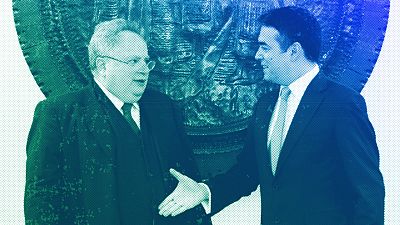 Greece's Foreign Minister Nikos Kotzias, left, shakes hands with his Macedonian counterpart Nikola Dimitrov at the foreign ministry in Skopje, March 2018