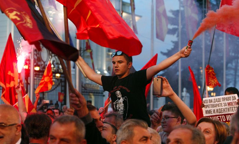 People demonstrate at a VMRO-DPMNE-organised protest in front of the Government building in Skopje, June 2018