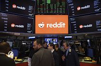 Reddit Inc. signage is seen on the New York Stock Exchange trading floor prior to Reddit's IPO launch, Thursday, March. 21, 2024. 