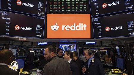 Reddit Inc. signage is seen on the New York Stock Exchange trading floor prior to Reddit's IPO launch, Thursday, March. 21, 2024. 