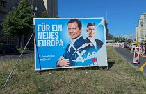 Damaged AfD poster in Berlin
