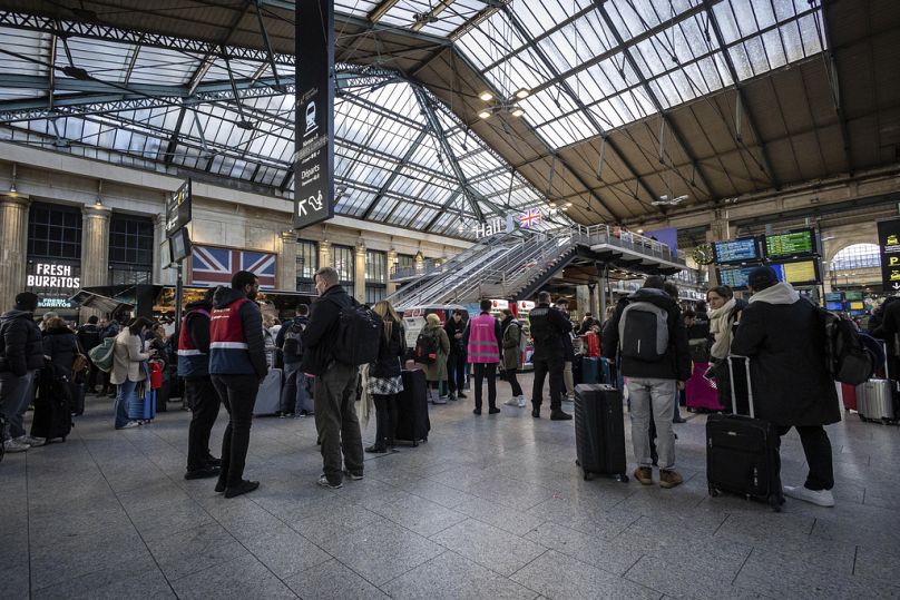 Eurostar passengers wait in the Gare du Nord concourse.