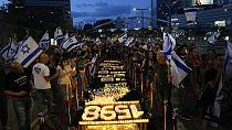 People protest against Israeli Prime Minister Benjamin Netanyahu's government and call for the release of hostages, in Tel Aviv, Israel, Saturday, May 11, 2024. 