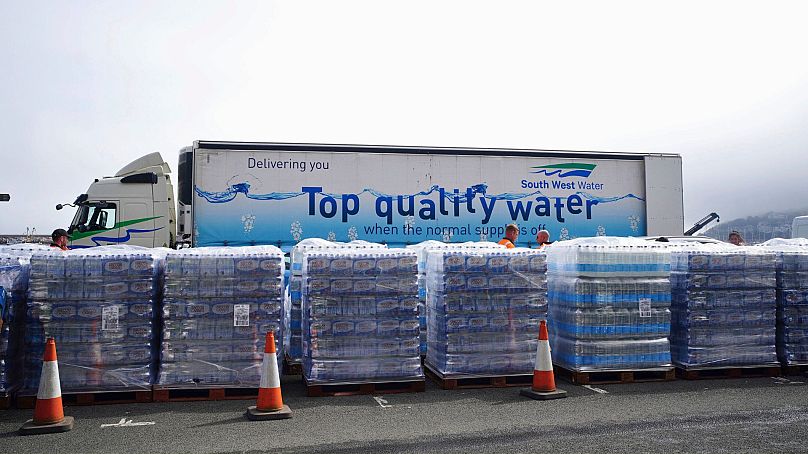 Bottled water is seen at Freshwater car park in Brixham, England, Friday 17 May 2024.
