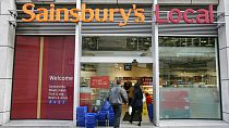 The company logo for the Sainsbury's food store chain at their Holborn building in London, Monday Nov. 20, 2006. (AP Photo/Alastair Grant)