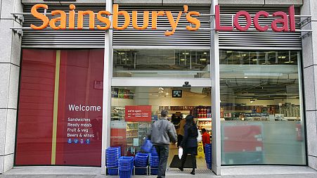 The company logo for the Sainsbury's food store chain at their Holborn building in London, Monday Nov. 20, 2006. (AP Photo/Alastair Grant)