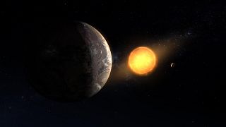 An artist’s concept of the exoplanet SPECULOOS-3 b orbiting its red dwarf star. The planet is as big around as Earth, while its star is slightly bigger than Jupiter – but much
