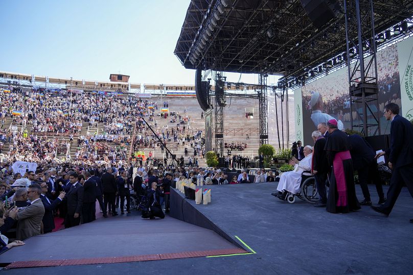 Pope Francis arrives at Verona's ancient Roman arena for the "Arena of Peace - Justice and Peace Will Embrace" meeting in the Italian city of Verona, Saturday, May 18, 2024.