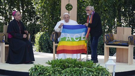Pope Francis is offered a 'peace flag' during the 'Arena of Peace - Justice and Peace Will Embrace' meeting in Verona, Italy, Saturday, May 18,2 2024.
