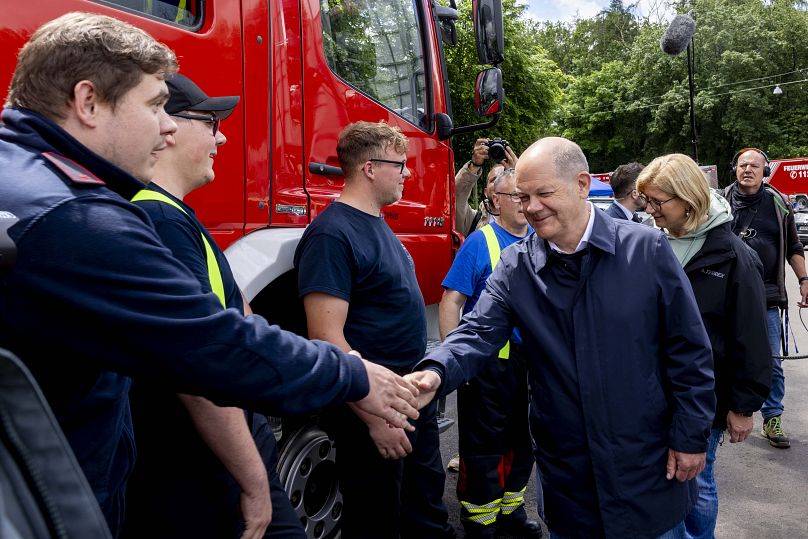 German Chancellor Olaf Scholz meets the emergency services personnel who were deployed to help with the flooding in Saarbruecken, Germany, Saturday, May 18, 2024.