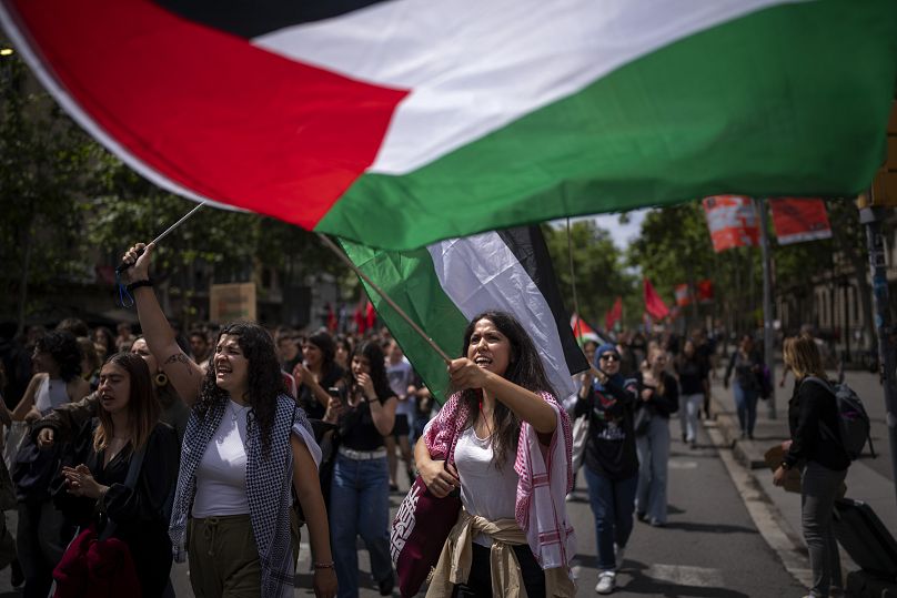Students wave Palestinian flags as they march to show solidarity with Palestinians and to commemorate the Nakba Day, Arabic for catastrophe, in Barcelona, Spain, May 15, 2024.