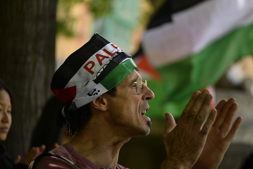 A supporter of Palestinians in Gaza shouts slogans during a demonstration against the Israel-Hamas war, in Pamplona, northern Spain, Saturday, May 18, 2024.